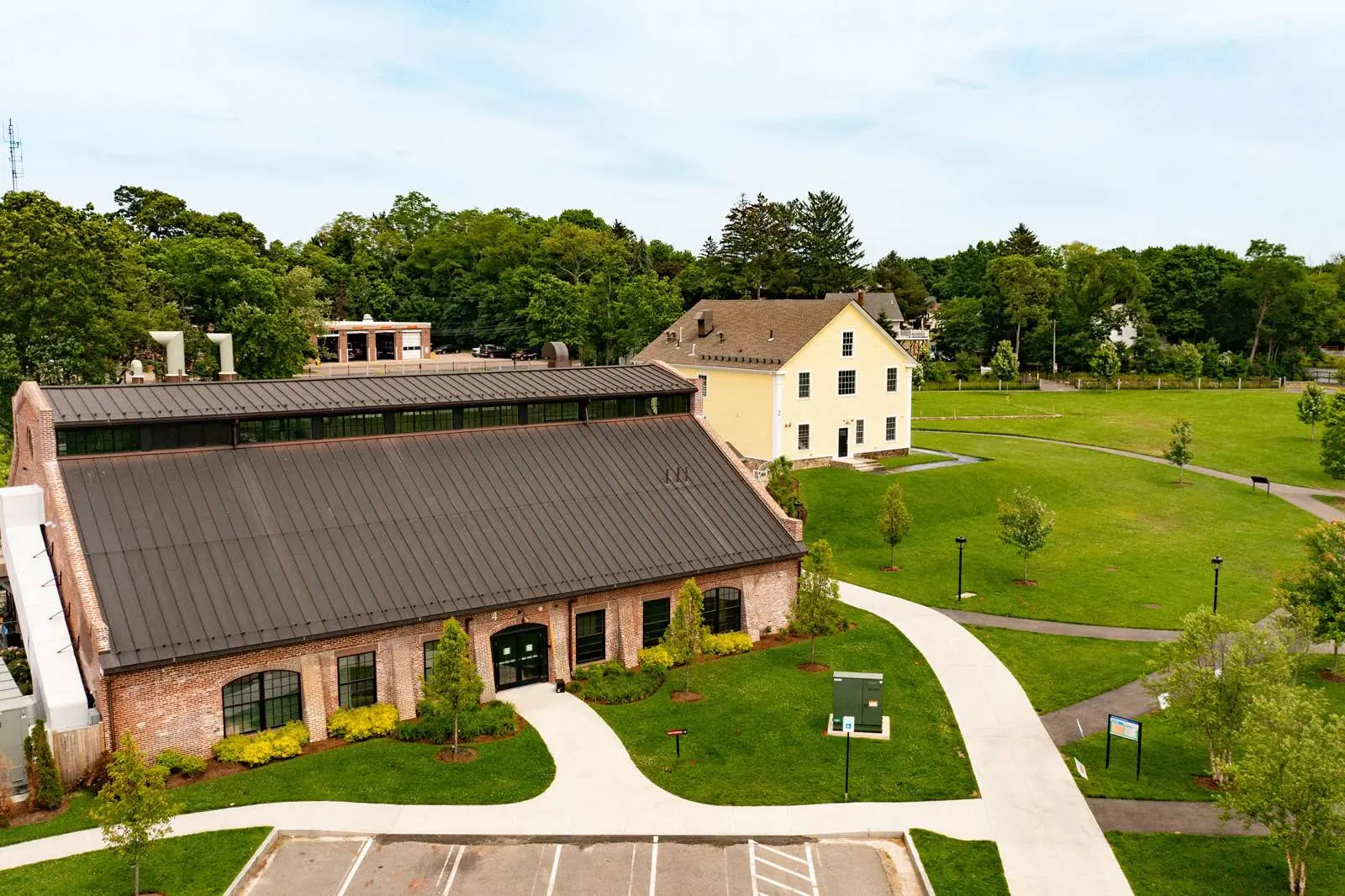 Aerial view of the restored Paul Revere Heritage Site today — the Revere Copper Rolling Mill, Draft Horse Barn, and surrounding green space.