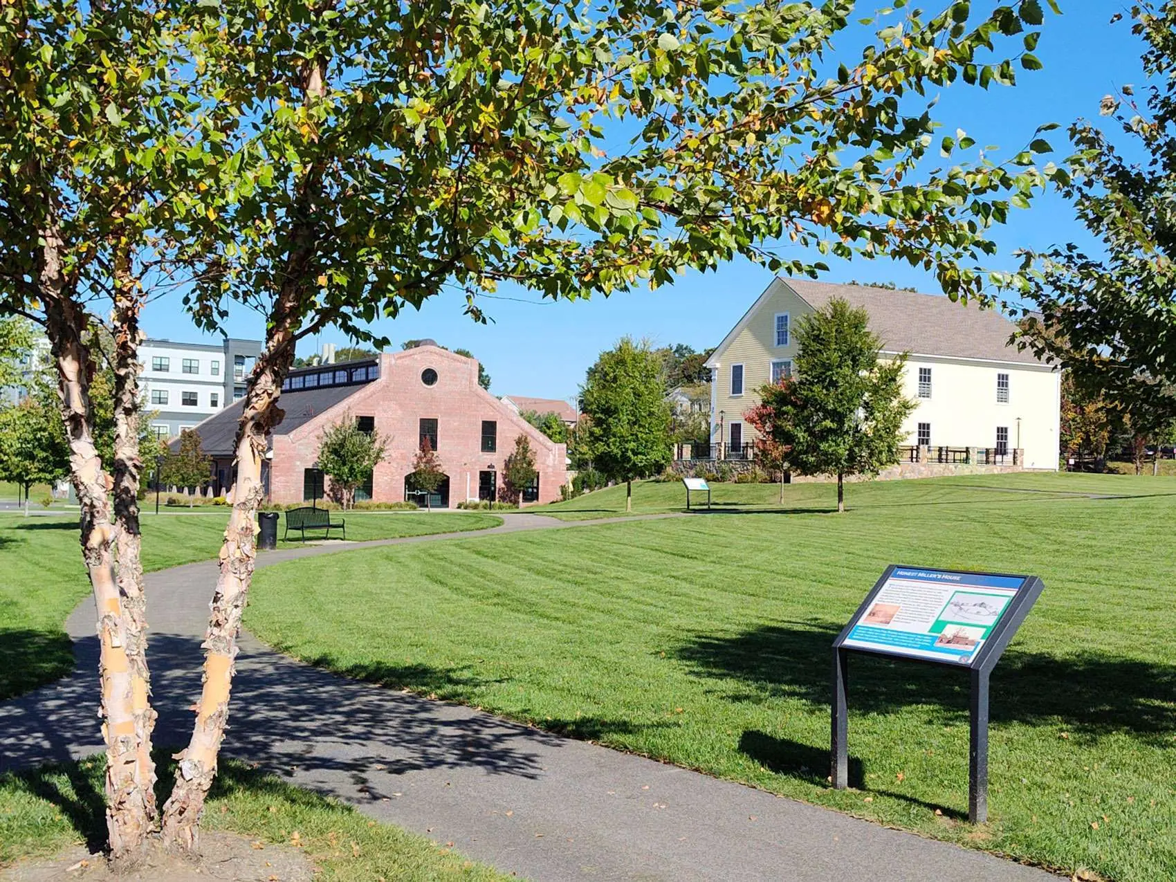 The restored Revere Copper Rolling Mill and Revere Draft Horse Barn on the Revere Green.